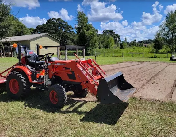 Compact tractor used for bush hog mowing and field work in Marion County FL